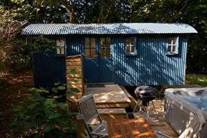 Shepherds Hut now with deck and hot-tub in place